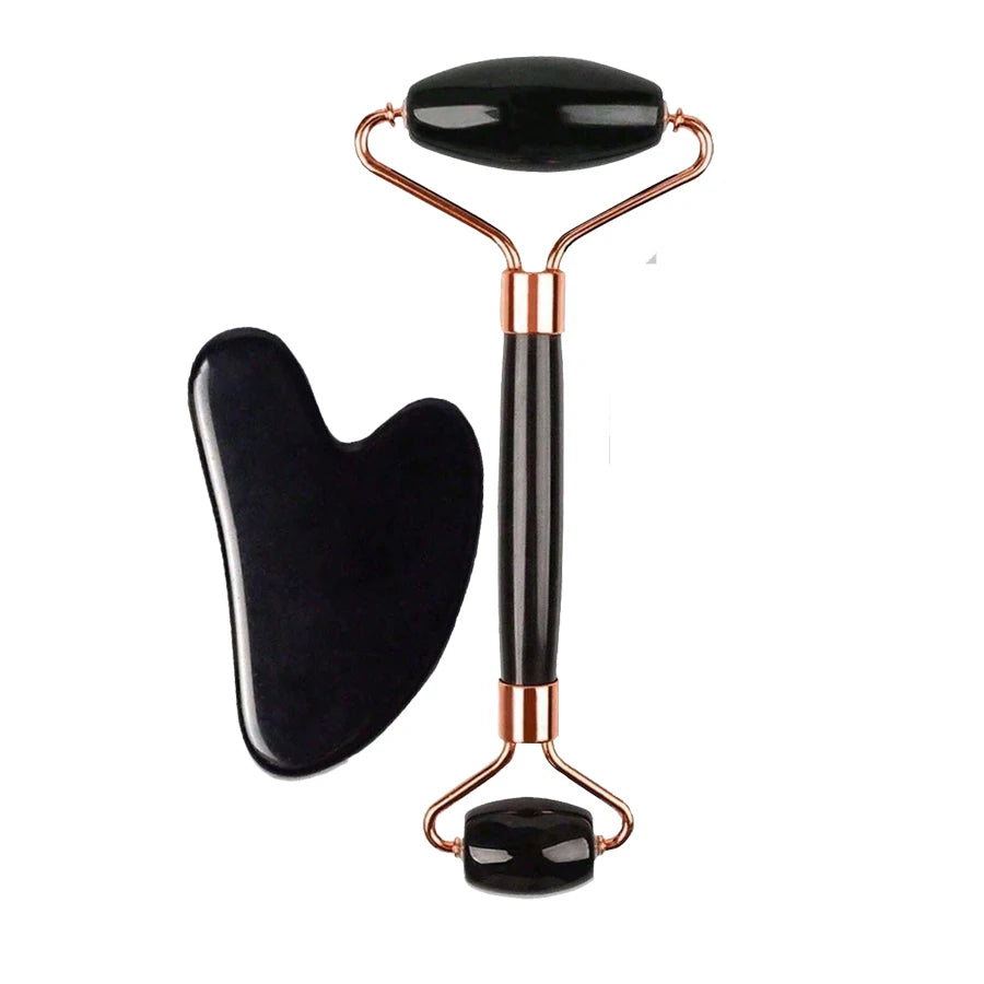 Black facial roller and gua sha tool on a white background